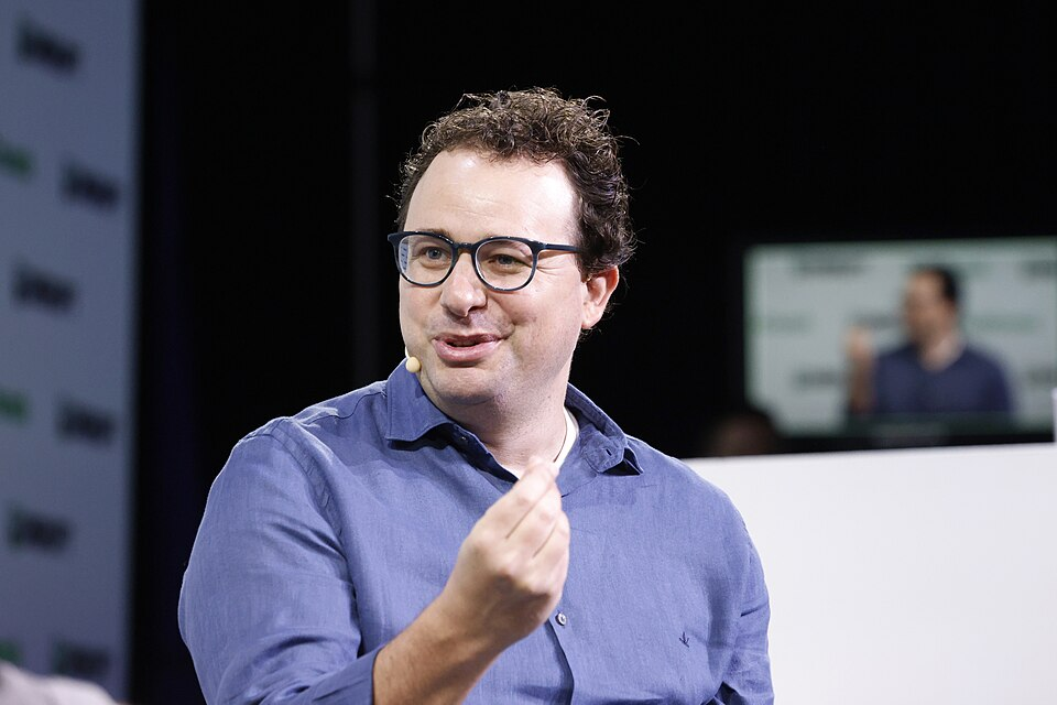 Dario Amodei, Anthropic CEO, speaking onstage at TechCrunch Disrupt as he argues for pacing frontier AI development
